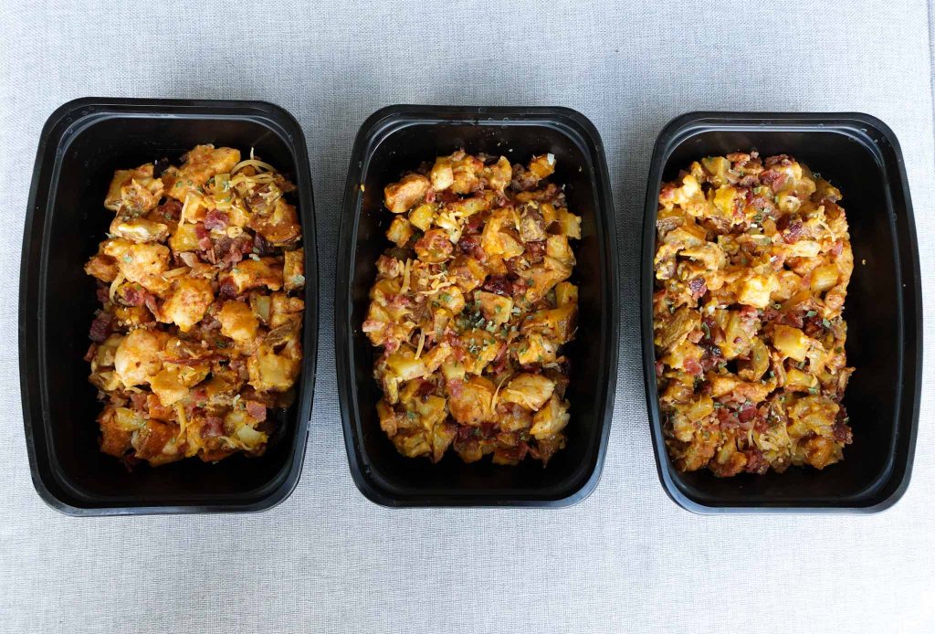 three meal prep container filled with potato bacon cheese chicken